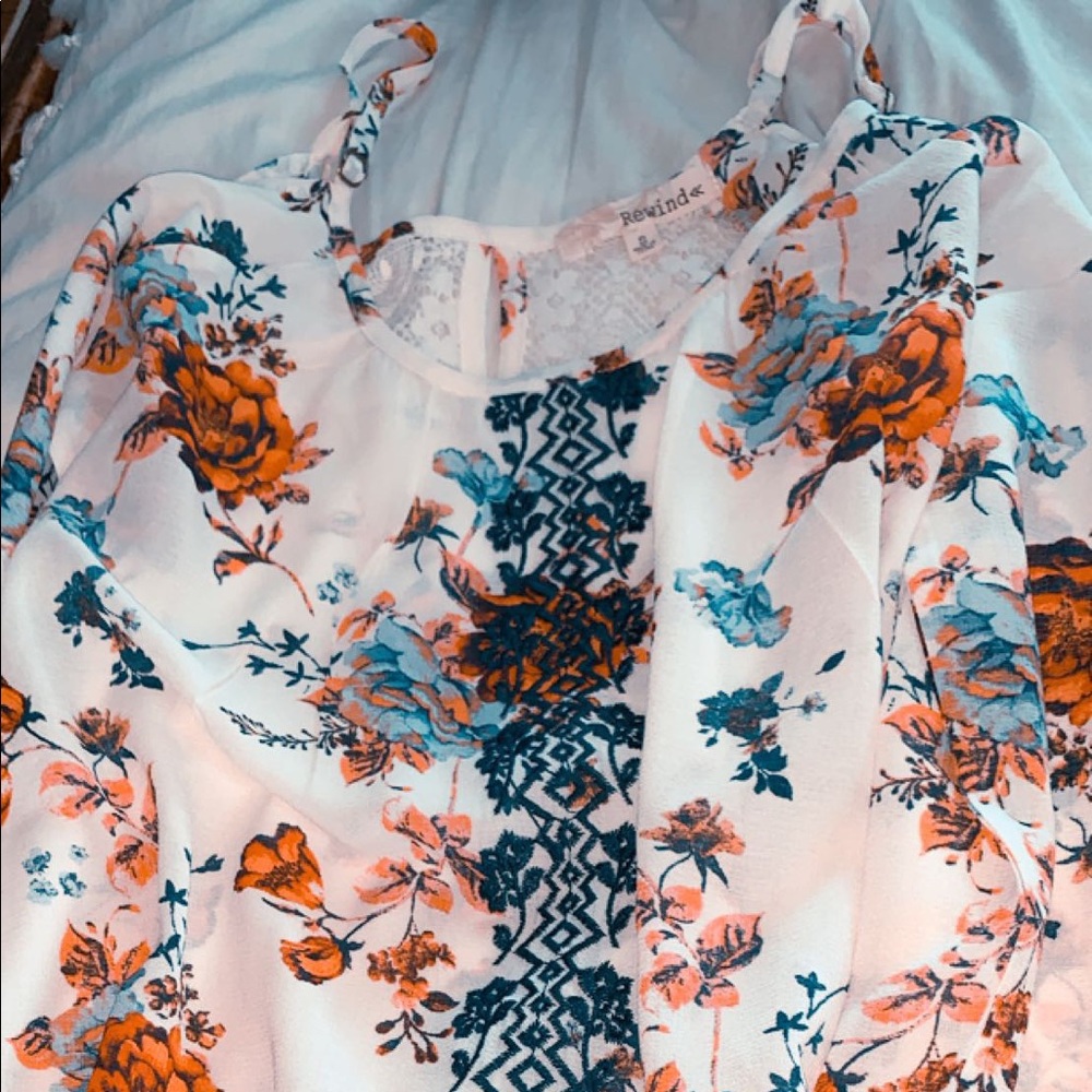 an off the shoulder floral long sleeve shirt